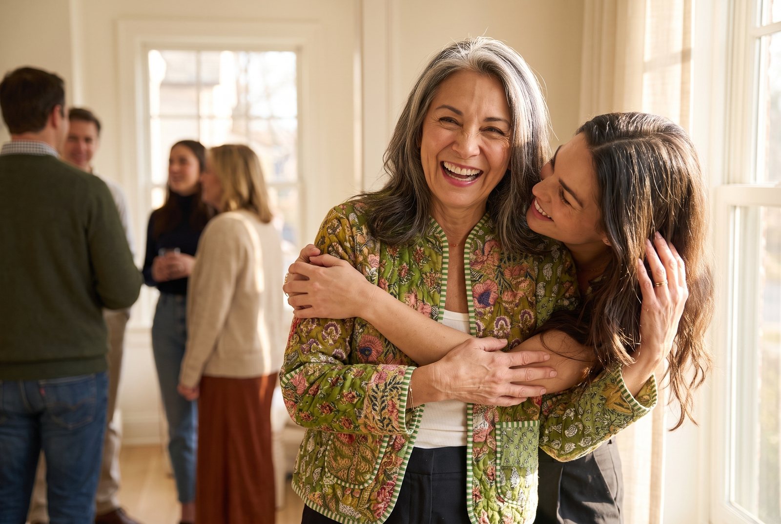 A woman in a House of Sundar quilted jacket laughing with her daughter