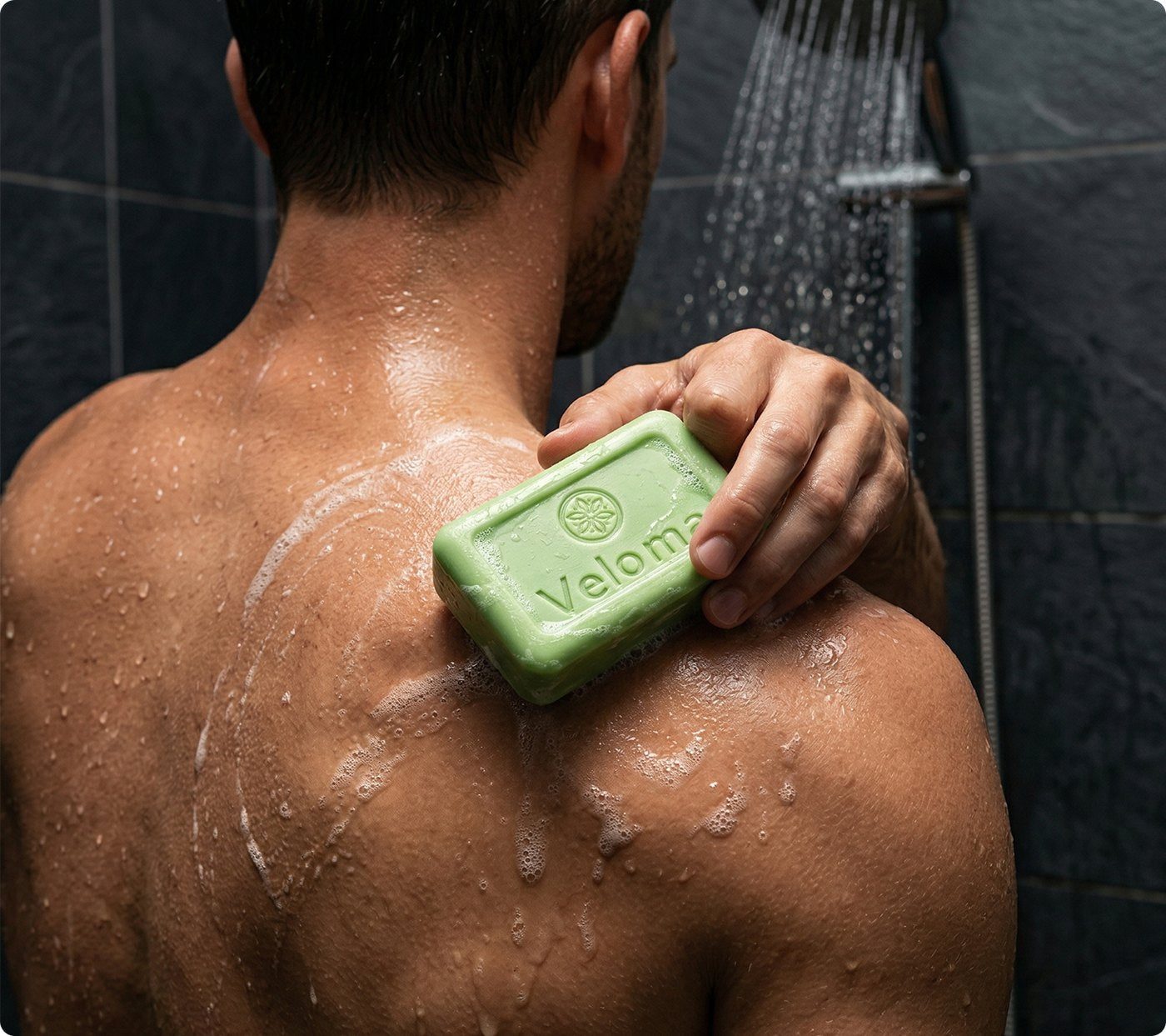 Man using the Sawumi antifungal bar in the shower